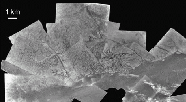Figure 3: Valleys or channels (dark quasi-liner or sinuous features) discovered on Titan by the Huygens probe. Descent Imager/Spectral Radiometer (DISR) image mosaic. [image and caption by [Komatsu, 2007]; image credit: ESA/NASA/University of Arizona].